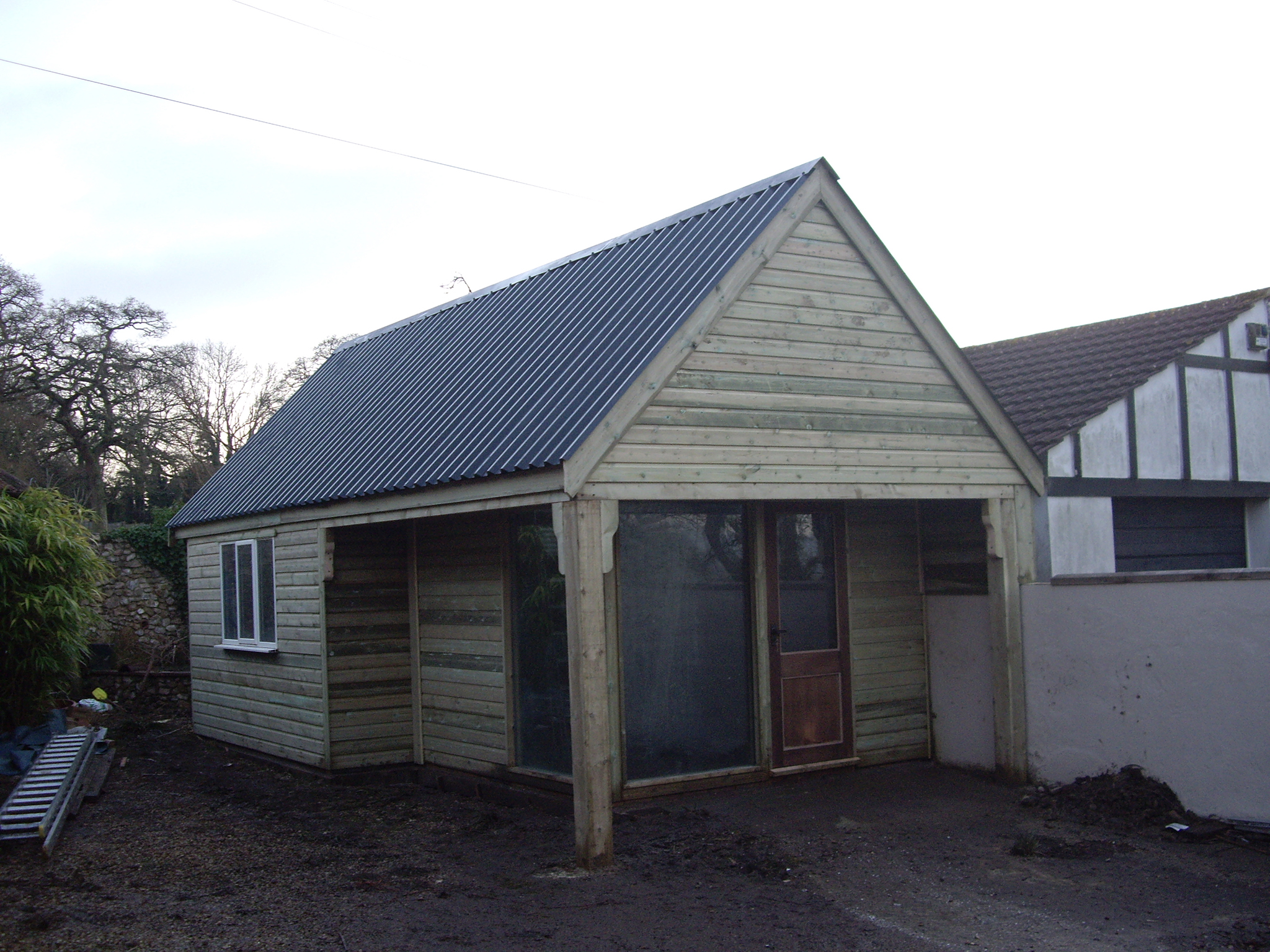 Oak framed office, with double glazed doors and finished with a 0.7mm plastic coated box profile tin roof (colour Anthracite) - Harris Timber Products